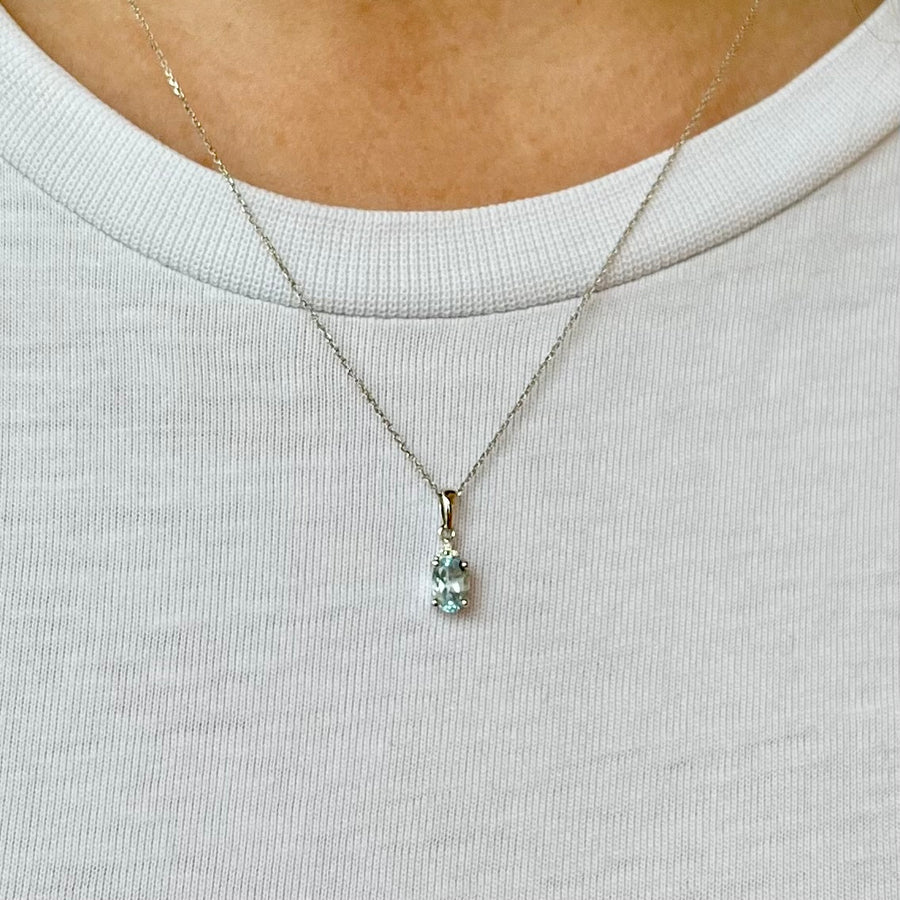 Oval Blue Topaz and Diamond Pendant in 9ct White Gold