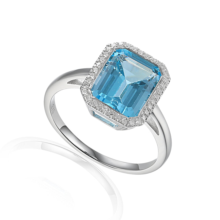 Emerald Cut Blue Topaz & Diamond Halo Ring in 9ct White Gold