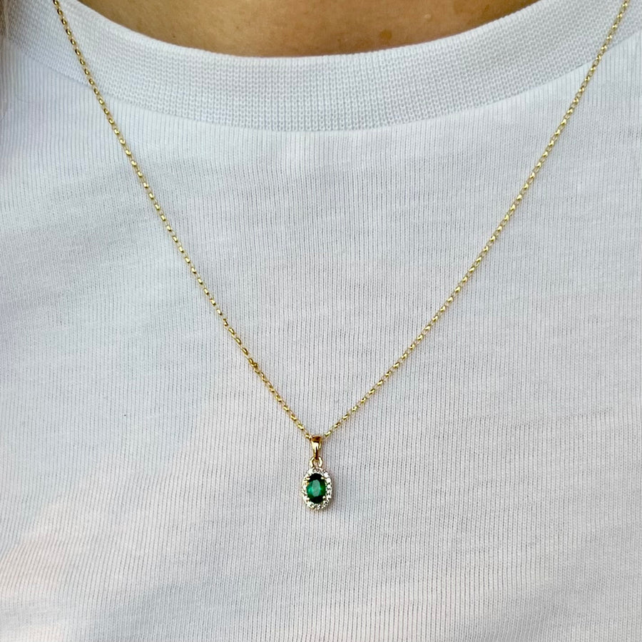 Oval Emerald and Diamond Halo Pendant in 9ct Yellow Gold