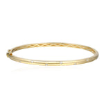 Gold bracelet with diamonds on a white background