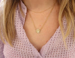 9ct gold Star disc necklace on women's neck