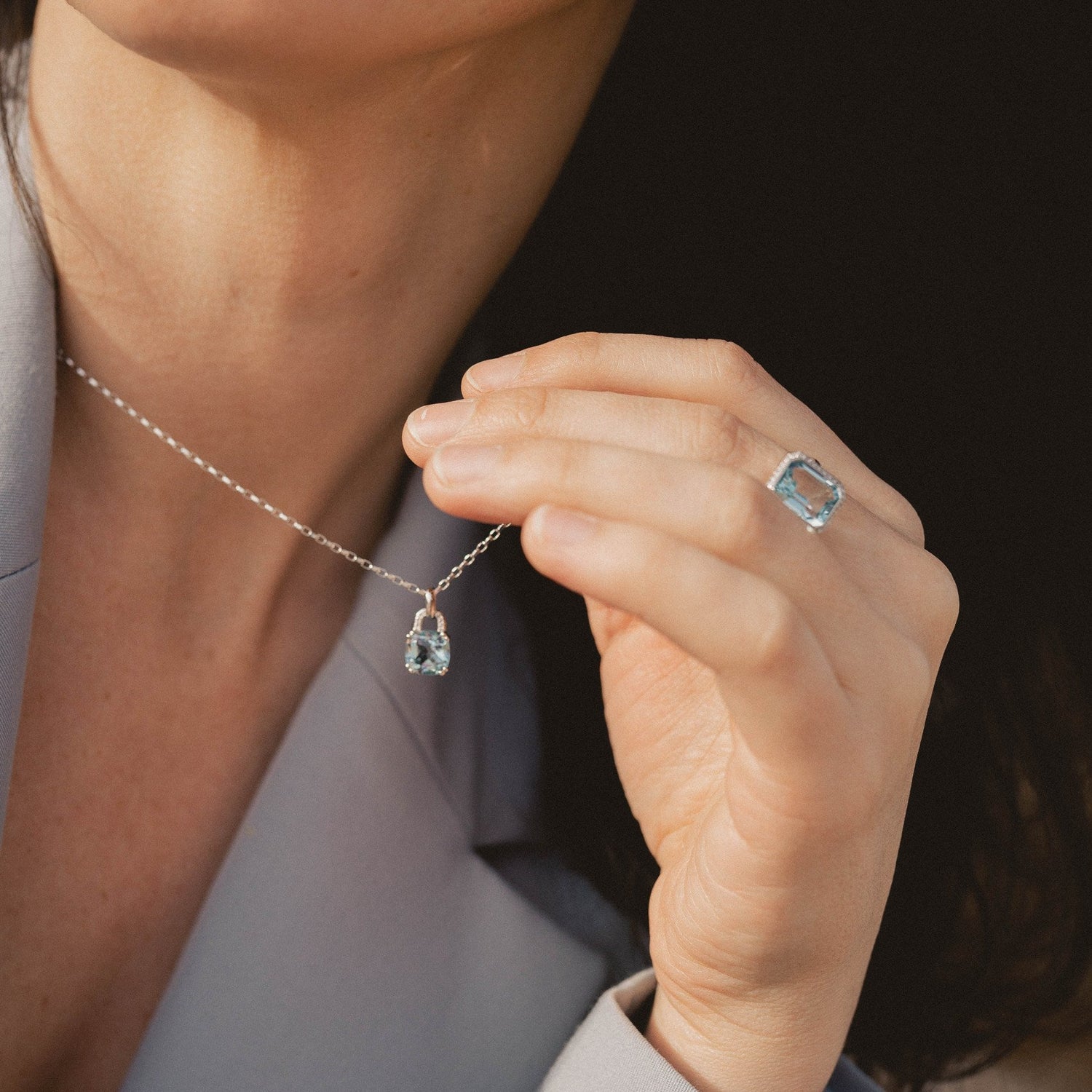 Emerald Cut Blue Topaz & Diamond Halo Ring in 9ct White Gold