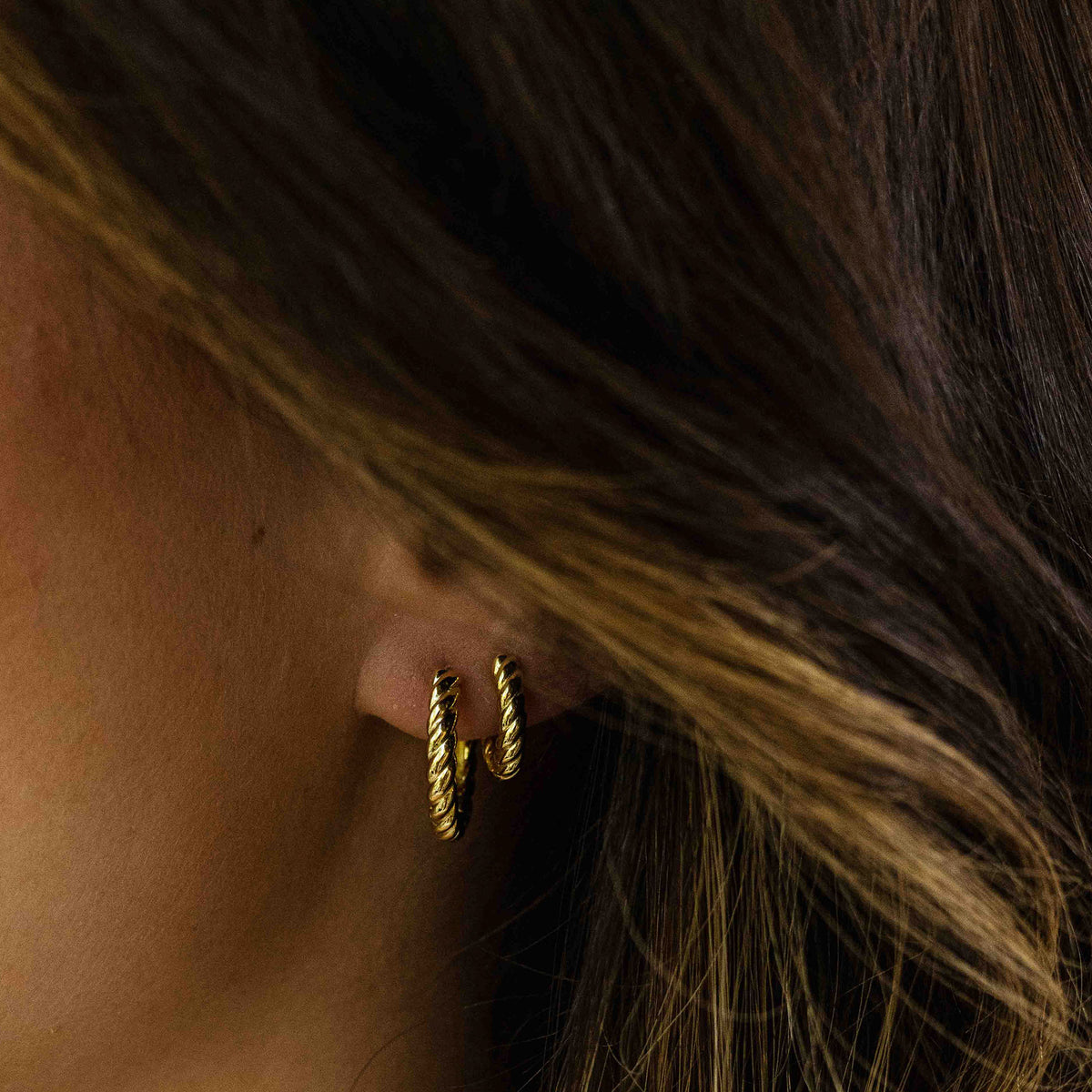 Medium hoop twist huggie style earring. 925 Sterling Silver and 18ct Gold Plated.