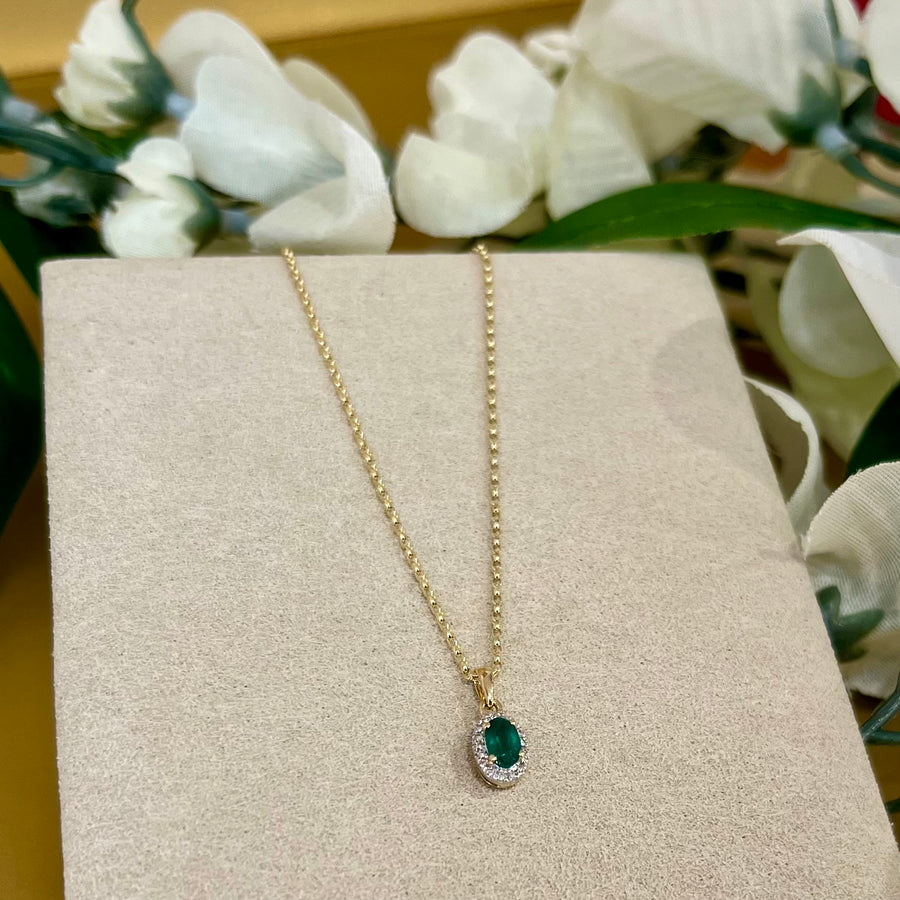 Oval Emerald and Diamond Halo Pendant in 9ct Yellow Gold