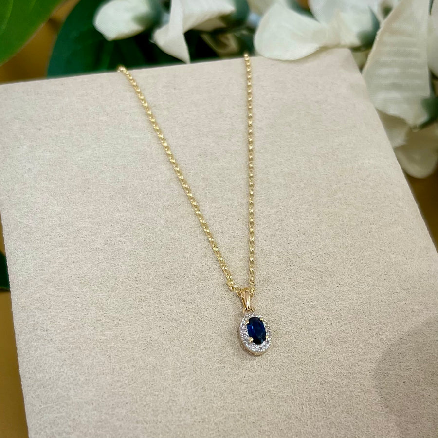 Oval Sapphire and Diamond Halo Pendant in 9ct Yellow Gold