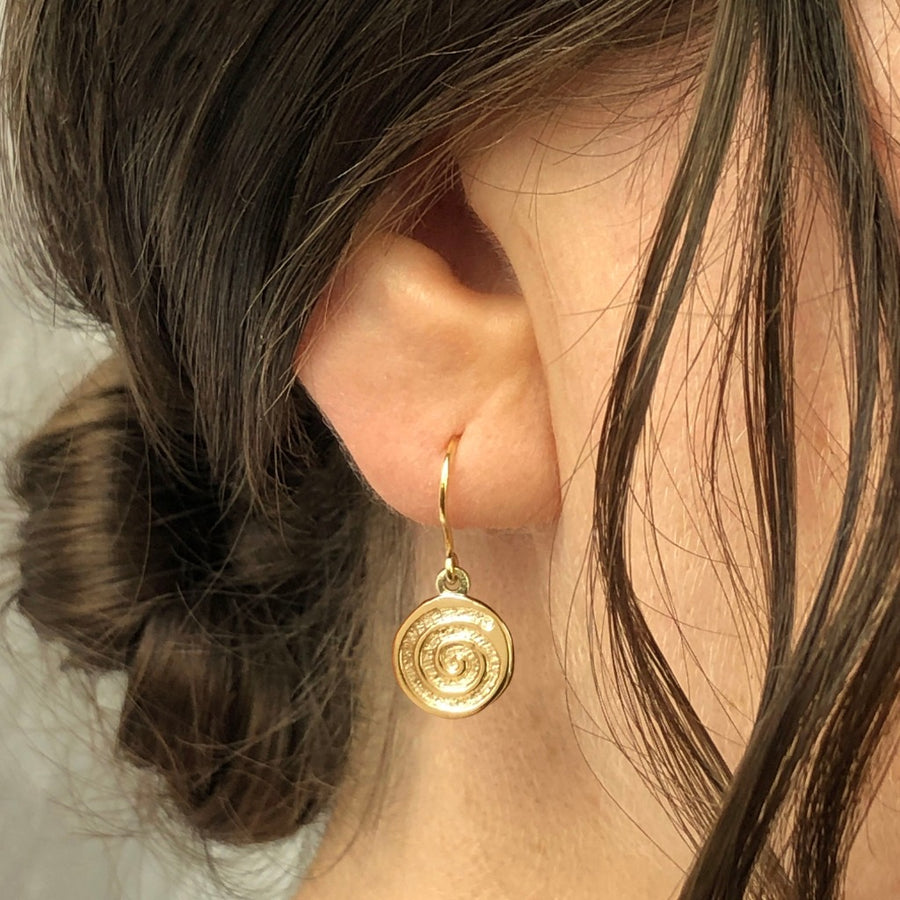 celtic spiral solid gold earrings by liwu jewellery on model 