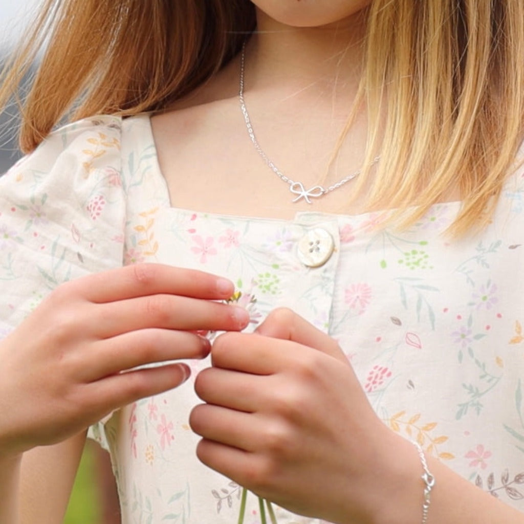 Darcy bow x Liwu necklace 