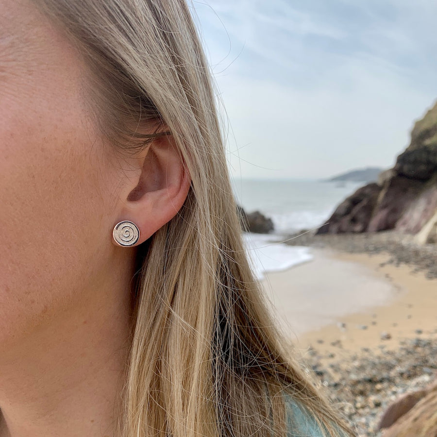 silver Celtic spiral studs on model