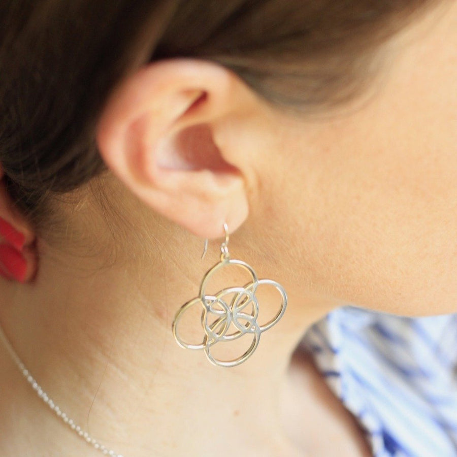serenity symbol earrings by irish jewelry brand liwu jewellery on model 