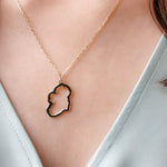 9ct gold map of ireland necklace on girls neck